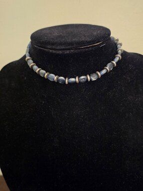 vintage necklace with a silver tone accent featuring beads and sponge coral